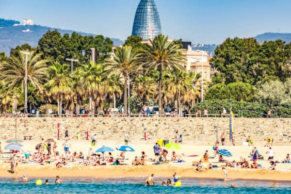 Barceloneta Beach from sea with crowds of people
