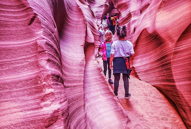 young girls inside Lower Antelope Canyon