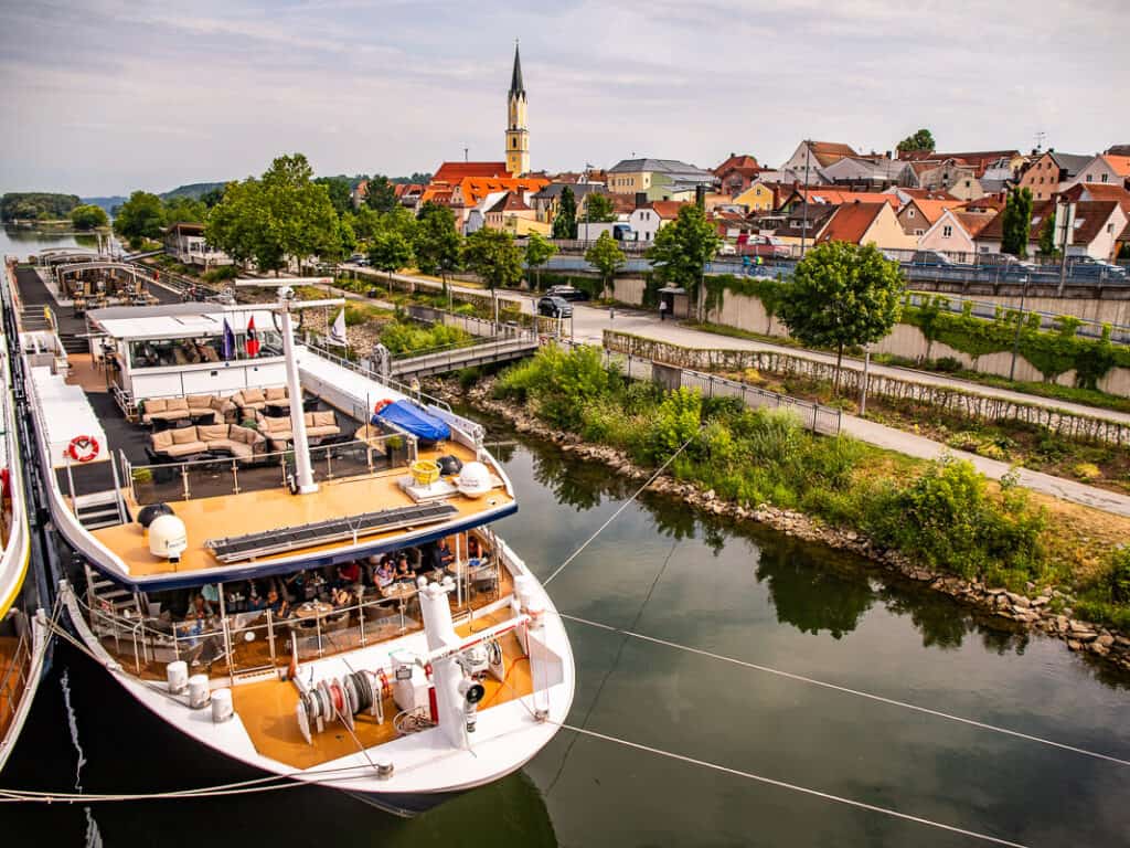 river cruise boat near river shore