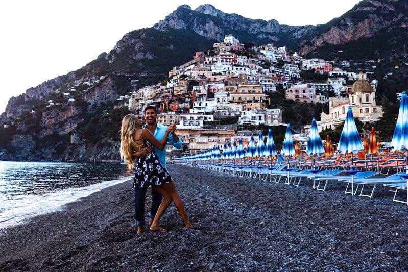 people standing on a beach