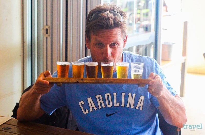 man with flight of beer