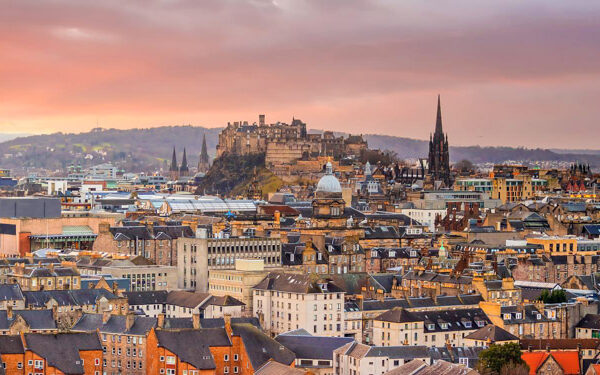 Old town Edinburgh city skyline. Cityscape in Scotland at sunset