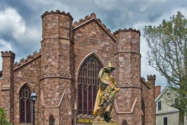 witch statue outside church