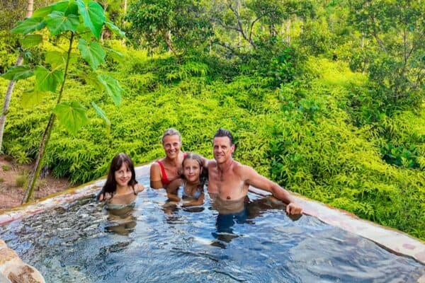 family sitting in private plunge pool hidden valley villa