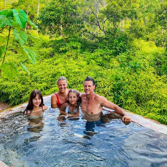 family sitting in private plunge pool hidden valley villa